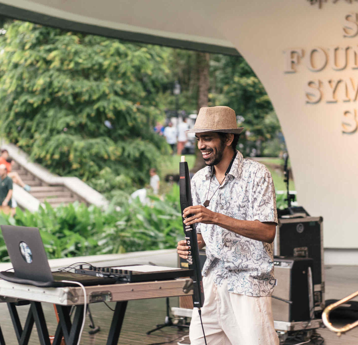 Circle‑style music team‑building in Singapore Music Workshop Singapore team sitting in a circle, singing and creating music together as part of a team‑building workshop in Singapore